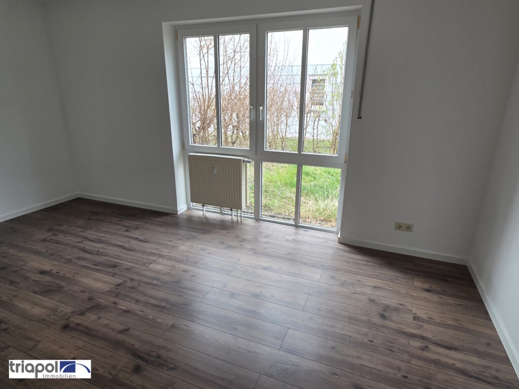 Schöne und ruhig gelegene Erdgeschoss mit neuem Laminatboden, Terrasse und kl. Gartenanteil in Coswig.